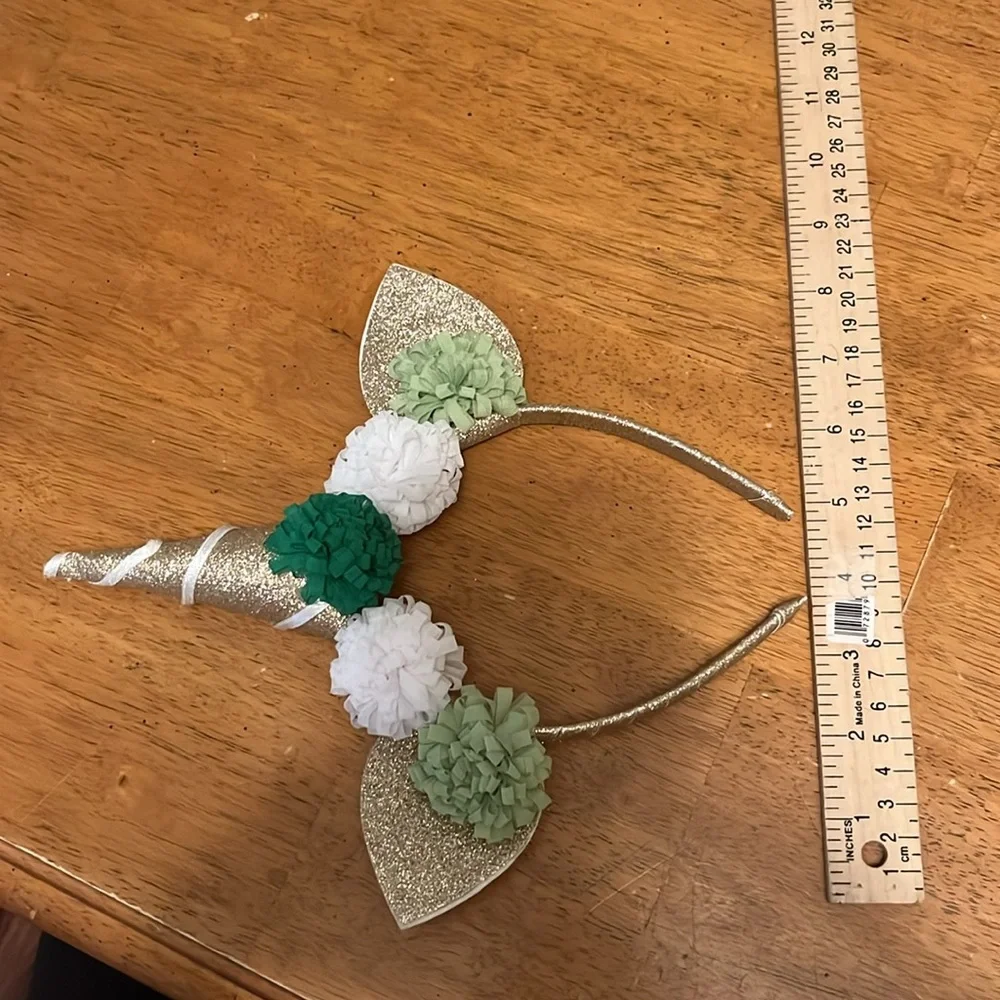 Gold Glitter Unicorn Headband With Green and White Pom Poms